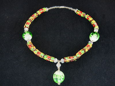 Brown beads, w/orange, red & green painted designs with green accent stones; on nylon wire; approx. 18" long; w/screw clasp.