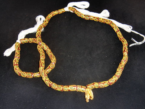 Brown w/hand-painted orange circles & golden accents; on string / tie-on; neck beads approx. 25" long; wrist beads approx. 10 1/2" long.