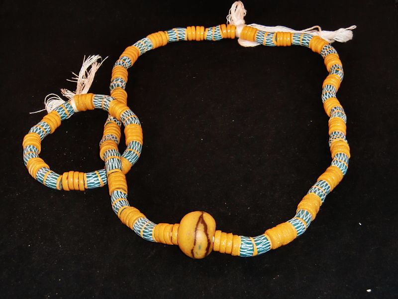 Sky blue w/beige spacer beads, hand-painted beige designs & accent stone; on string / tie-on; neck beads approx. 36" long; wrist beads approx. 11" long.
